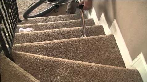 performing the stairs carpet cleaning process